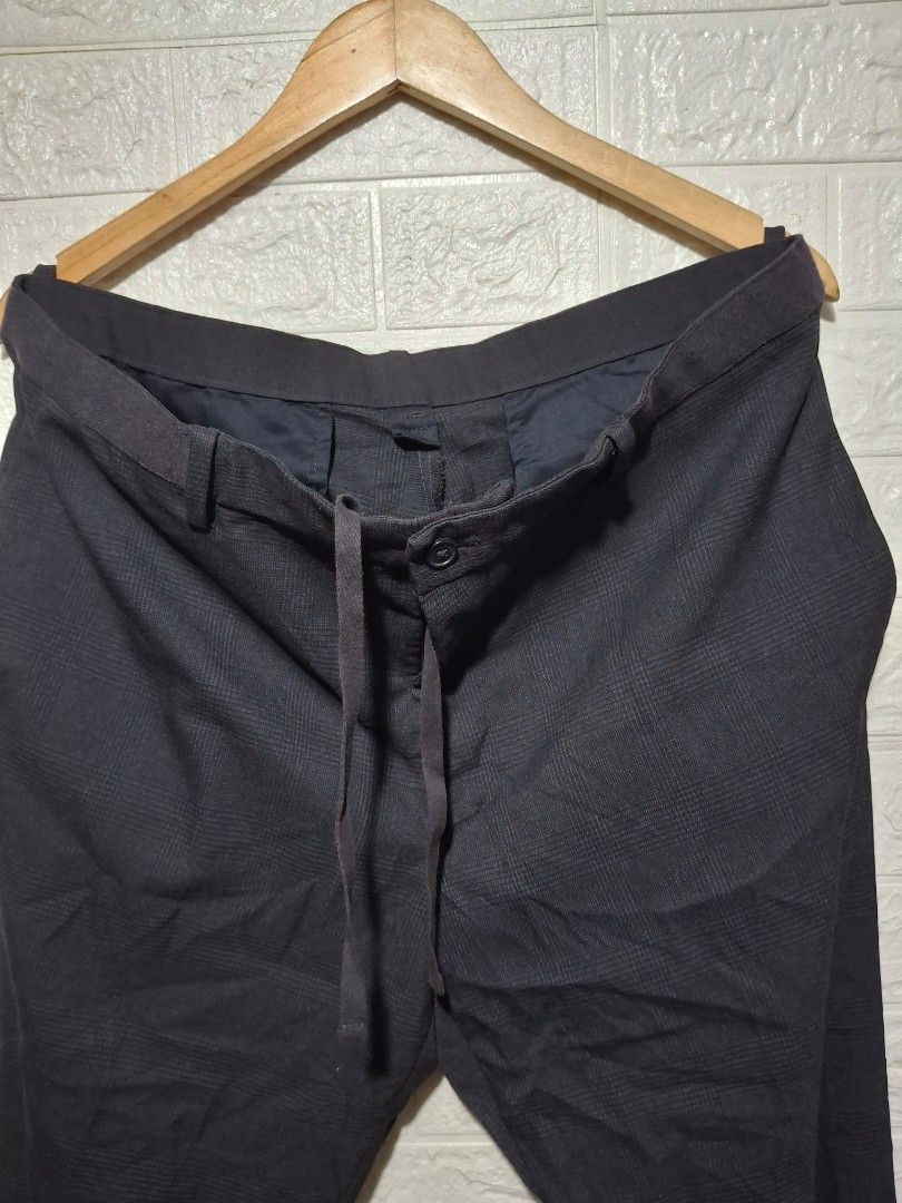 Uniqlo Checked Drawstring Trousers XL (Category: Trousers) located in Angeles City. Submitted by livemountain.e2ae07 (Listing ID 1468547152, Image 2). Description: - Brand: Uniqlo - Color: Navy blue with classic check pattern - Size: XL (fits 92-100cm waist) - W18 L36 HEM 7.6 - Material: Lightweight blend of polyester, rayon, and polyurethane - Waistband: Elastic with adjustable drawstring - Closure: Button fly - Pockets: Two back pockets with bu