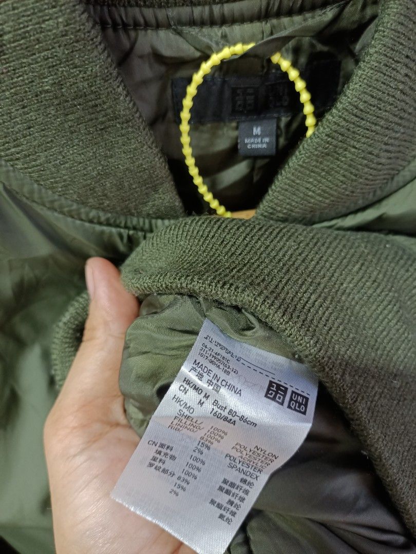 Uniqlo Olive Green Bomber Jacket Size M (Category: Coats, Jackets and Outerwear) located in Bayombong. Submitted by rheaaa00530 (Listing ID 1468624443, Image 2). Description: - Brand: Uniqlo - Item: Bomber Jacket - Color: Olive Green - Size: M (Bust: 80-86cm, Height: 160/84A) - Materials: 100% nylon shell; 100% polyester filling and lining; Ribbing (83% polyester, 15% acrylic, 2% spandex) - Features: Full zip front, ribbed collar/cuffs/hem, and t
