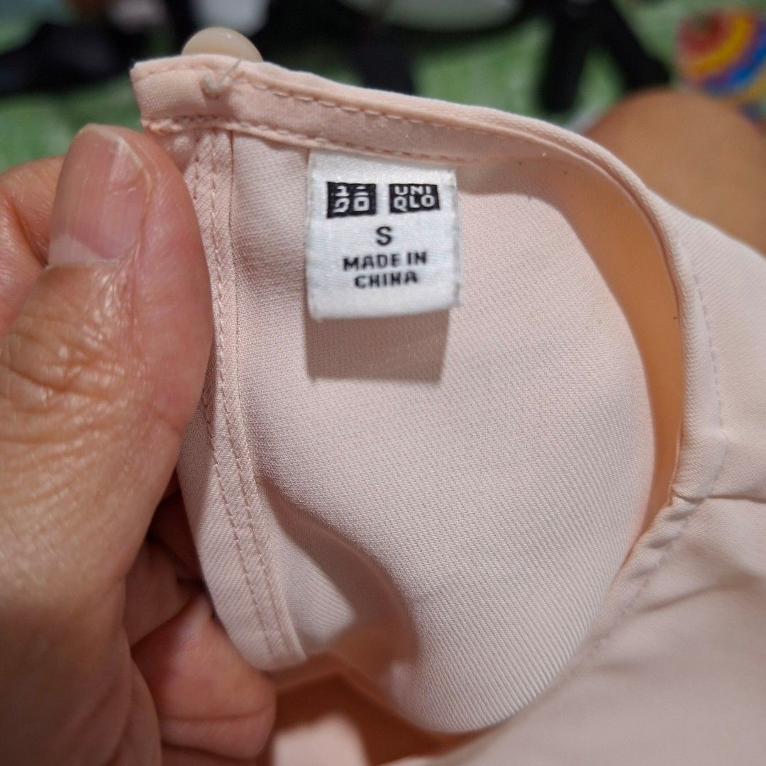 Uniqlo Pink Sleeveless Blouse Size S (Category: Sleeveless) located in Imus. Submitted by jgz21 (Listing ID 1468683045, Image 3). Description: - Brand: Uniqlo - Color: Soft Pink - Size: S (Tag attached, brand new) - Material: 100% Polyester (lightweight) - Features: Round neckline, button closure at the back collar - Condition: Clean, closet clearout, ready to wear.