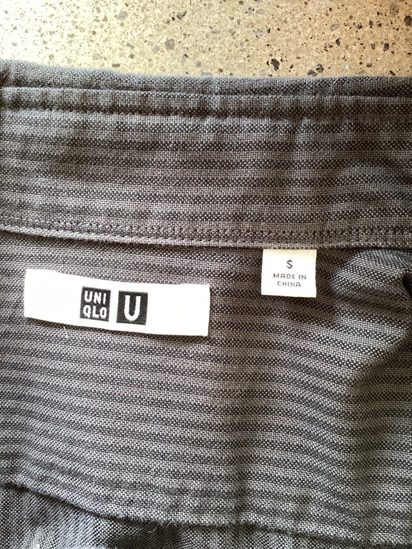 Uniqlo U Long Sleeve Button Down Shirt Size S (Category: Tshirts & Polo Shirts ) located in Bacoor. Submitted by cts217 (Listing ID 1468506899, Image 3). Description: - Brand/Model: Uniqlo U - Color: Dark grey with subtle vertical texture - Size: Small - Details: Standard button-down collar, single chest pocket, adjustable cuffs - Condition: Clean overall shape, ready for regular wear.