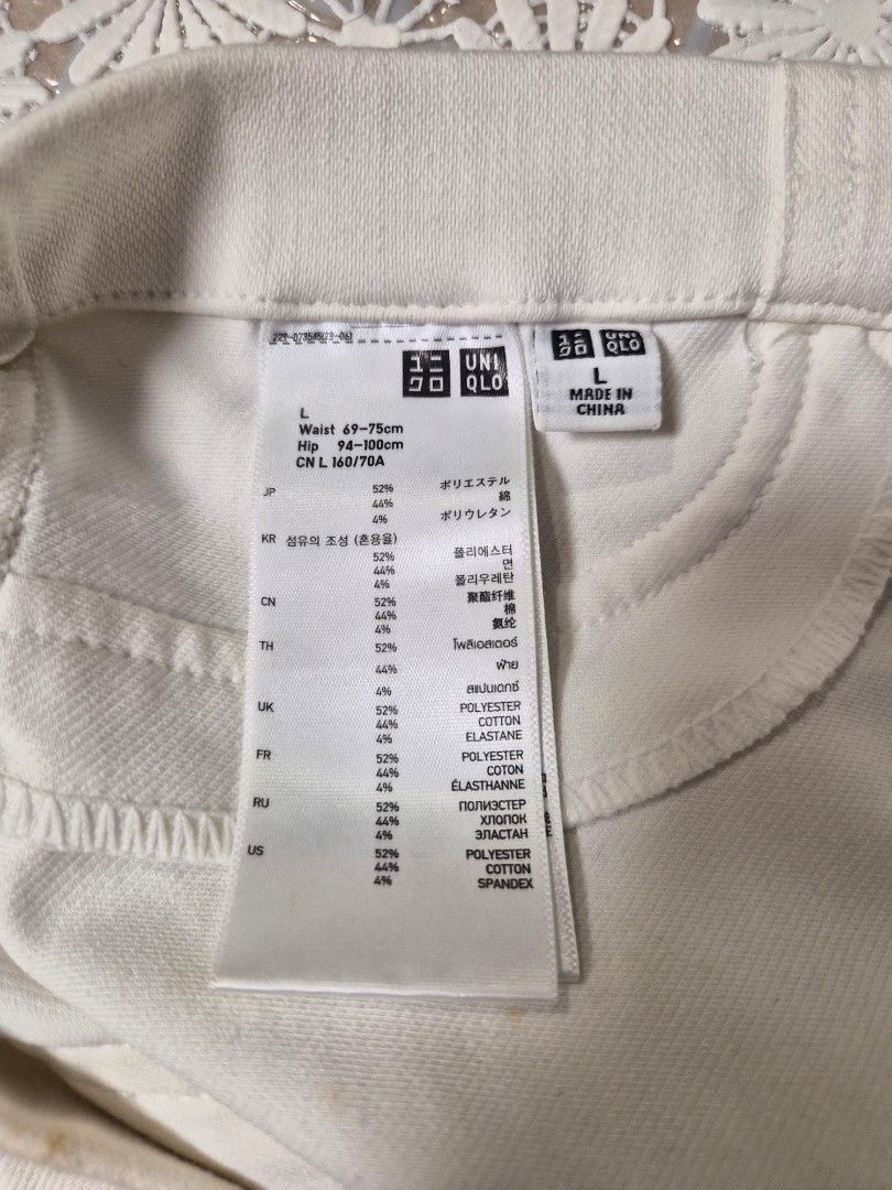 Uniqlo White Legging Pants Size L (Category: Jeans) located in Manila. Submitted by prelovedbyc.hannah (Listing ID 1468589090, Image 3). Description: - Brand/Item: Uniqlo White Legging Pants - Size: L (Waist: 69-75cm | Hip: 94-100cm) - Material: Polyester, Cotton, and Spandex blend - Condition: Pre-loved with several yellowish stains scattered on the front and thigh areas - Important: Please review all pictures carefully for stain locations befor