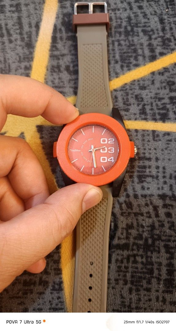 Unisilver watch (Category: Men's Watches) located in Quezon City. Submitted by junseller18 (Listing ID 1468554897, Image 2). Description: bago battery, - Brand: Unisilver orig - Model: KW1512-2011 - Design: Bold orange bezel with unique number dial and gray textured rubber strap - Movement & Build: Japan Movement, Stainless Steel Back - Water Resistance: 5 ATM Water Resistant - Condition: 7/10 (pre-loved, well-kept with minor signs of wear) - Per