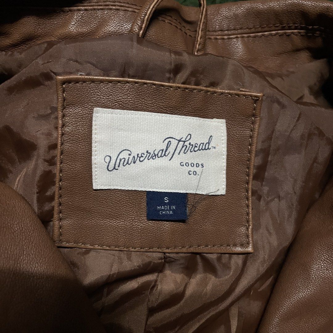 Universal Thread Faux Leather Biker Moto Jacket (Category: Coats, Jackets and Outerwear) located in Pasig City. Submitted by icie_finds (Listing ID 1468624458, Image 3). Description: Universal Thread Faux Leather Biker Moto Jacket SIZE: Tagged S (Fits Small) DIMES: Width: 20 inches Length: 21.5 inches Style: Classic asymmetrical zip faux leather biker jacket with zippered side pockets and ribbed sleeve details. Color: Cognac Brown / Caramel Measu