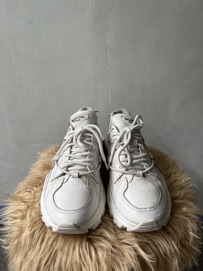 Valentino White Sneakers (Category: Sneakers) located in Binan City. Submitted by finders_market (Listing ID 1468507226, Image 2). Description: - White Valentino sneakers - Lace-up style with unique drawstring detail at the back - Chunky sole for comfort and style - Minor water spots on leather - Size 42 Mop bpi gcash Delivery via lalamove or jrs only Delivery fee c/o buyer.
