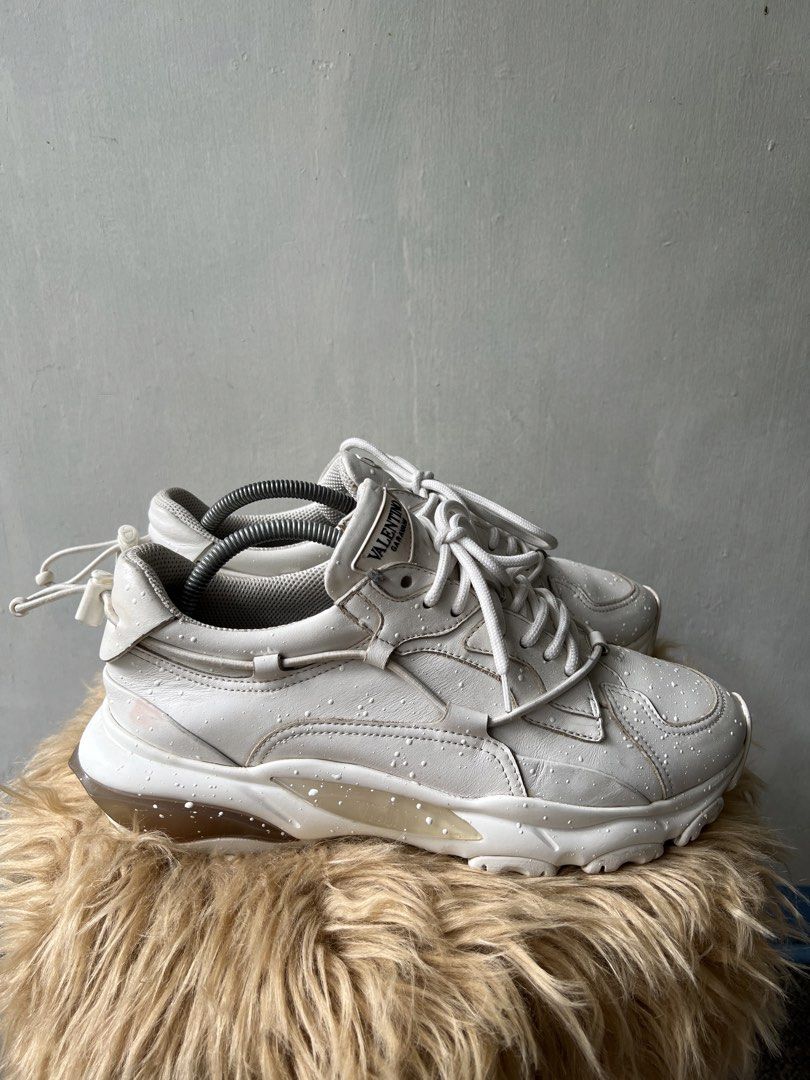 Valentino White Sneakers (Category: Sneakers) located in Binan City. Submitted by finders_market (Listing ID 1468507226, Image 3). Description: - White Valentino sneakers - Lace-up style with unique drawstring detail at the back - Chunky sole for comfort and style - Minor water spots on leather - Size 42 Mop bpi gcash Delivery via lalamove or jrs only Delivery fee c/o buyer.