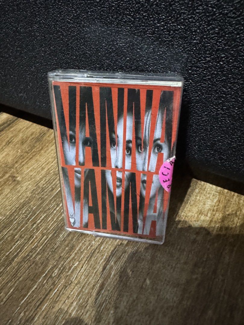 Vanna Vanna Cassette Tape (Category: CDs & DVDs) located in Cavite. Submitted by ms.cdjunkies (Listing ID 1468676773, Image 1). Description: - Item: Vanna Vanna original vintage cassette tape - Condition: Clear plastic jewel case has minor storage scuffs; playback untested, sold as-is - Design: Orange background with striking black and white portraits on cover - Detail: Features a small pink circular sticker on the bottom right corner - Perfect f