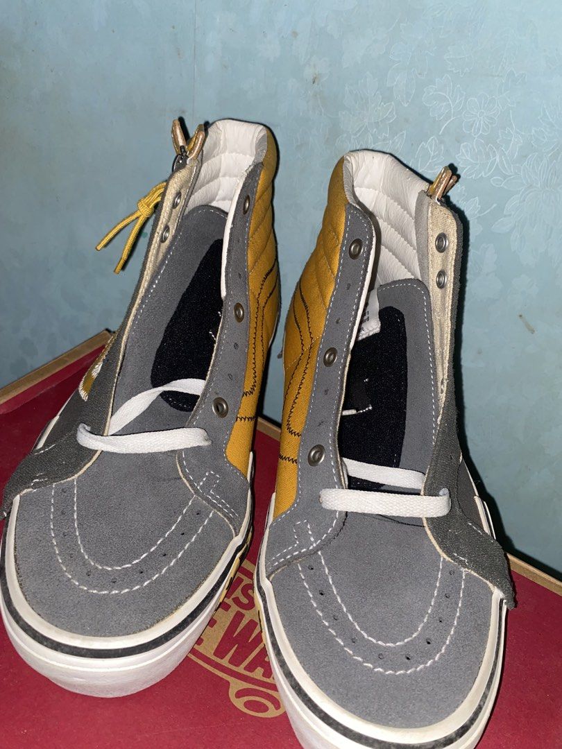 Vans Sk8-Hi Reissue Cap Multi Yellow Grey (Category: Sneakers) located in Pasig City. Submitted by six_seven67 (Listing ID 1468539877, Image 2). Description: - Brand: Vans High Tops - Condition: Like new with original box - Design: Deconstructed and asymmetric with yellow and grey panels - Details: Zipper entry along the collar, checkerboard pattern near the toe, and exposed stitching - Soles: White rubber soles featuring the iconic red 'Off The 
