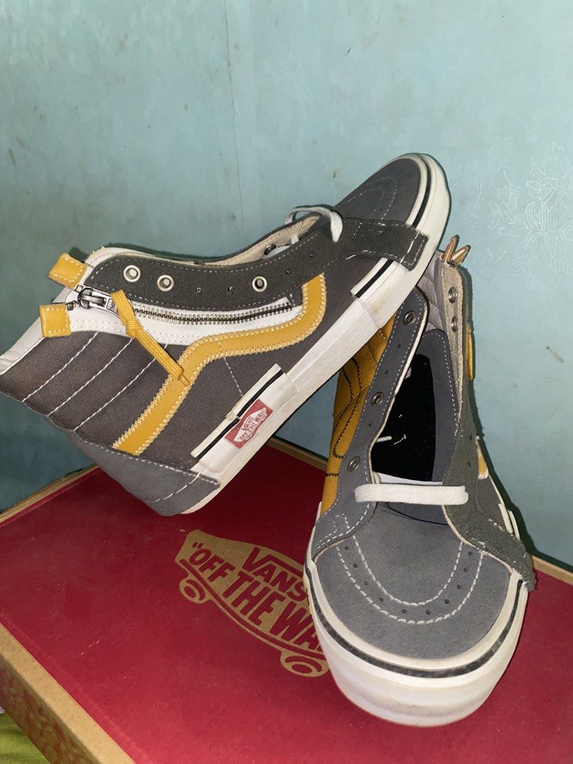 Vans Sk8-Hi Reissue Cap Multi Yellow Grey (Category: Sneakers) located in Pasig City. Submitted by six_seven67 (Listing ID 1468539877, Image 3). Description: - Brand: Vans High Tops - Condition: Like new with original box - Design: Deconstructed and asymmetric with yellow and grey panels - Details: Zipper entry along the collar, checkerboard pattern near the toe, and exposed stitching - Soles: White rubber soles featuring the iconic red 'Off The 