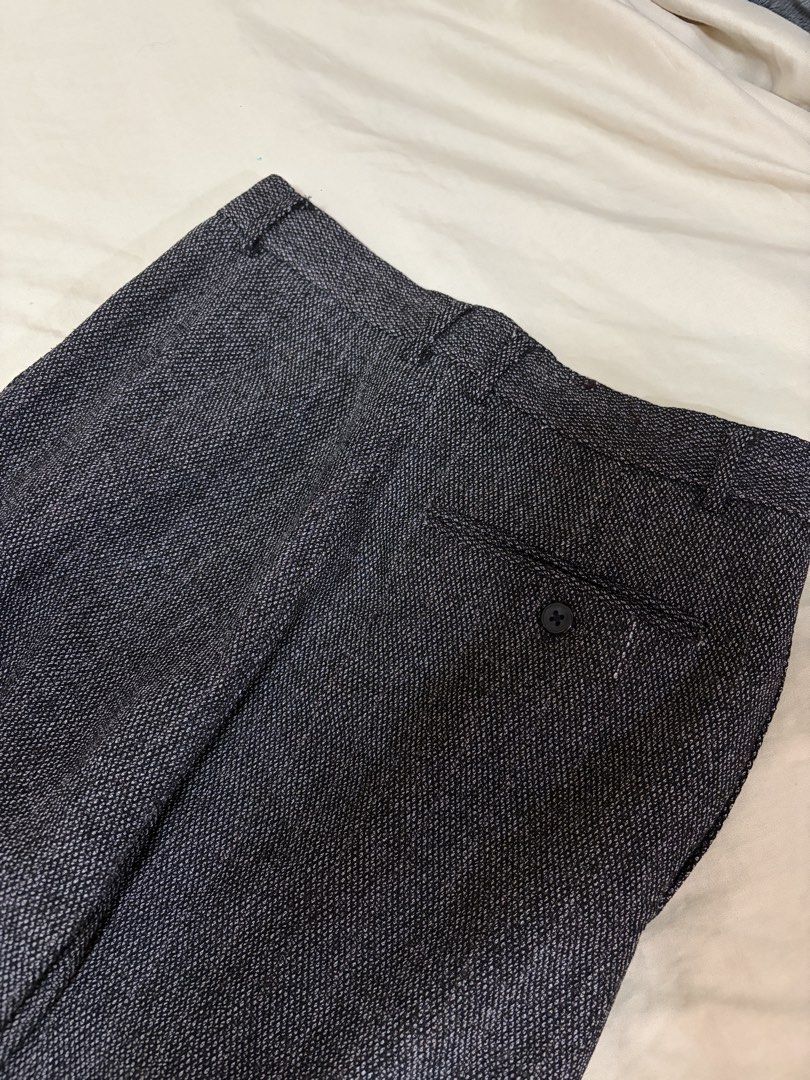 Versace Classic Dark Grey Textured Dress Pants (Category: Trousers) located in Mandaluyong City. Submitted by afterceej (Listing ID 1468659003, Image 3). Description: - Brand: Versace Classic -Size: 26inches - Color/Pattern: Dark grey textured weave - Style: High waist, pleated front, cuffed hems - Details: Back buttoned pocket, satin-lined inner waistband with branded pocket lining - Versatility: Ideal for formal or smart casual wear - Condition