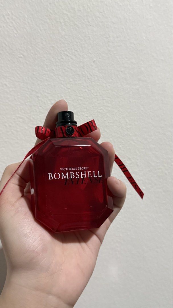 Victoria's Secret Bombshell Intense Eau de Parfum - RED (Category: Fragrance & Deodorants) located in Manila. Submitted by pheta (Listing ID 1468549512, Image 3). Description: - Brand: Victoria's Secret - Fragrance: Bombshell Intense - Scent Profile: Rich floral and fruity - Bottle Design: Red glass bottle with matching neck ribbon and spray nozzle - Inclusions: Bottle only (No box) - Condition: As seen in pictures, well-maintained.