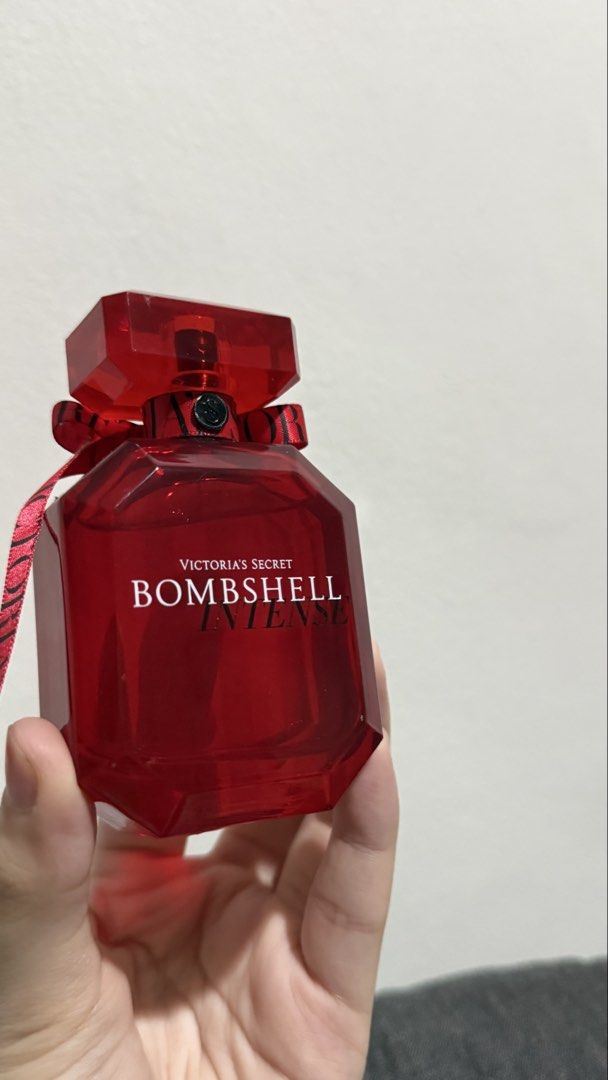Victoria's Secret Bombshell Intense Eau de Parfum - RED (Category: Fragrance & Deodorants) located in Manila. Submitted by pheta (Listing ID 1468549512, Image 2). Description: - Brand: Victoria's Secret - Fragrance: Bombshell Intense - Scent Profile: Rich floral and fruity - Bottle Design: Red glass bottle with matching neck ribbon and spray nozzle - Inclusions: Bottle only (No box) - Condition: As seen in pictures, well-maintained.