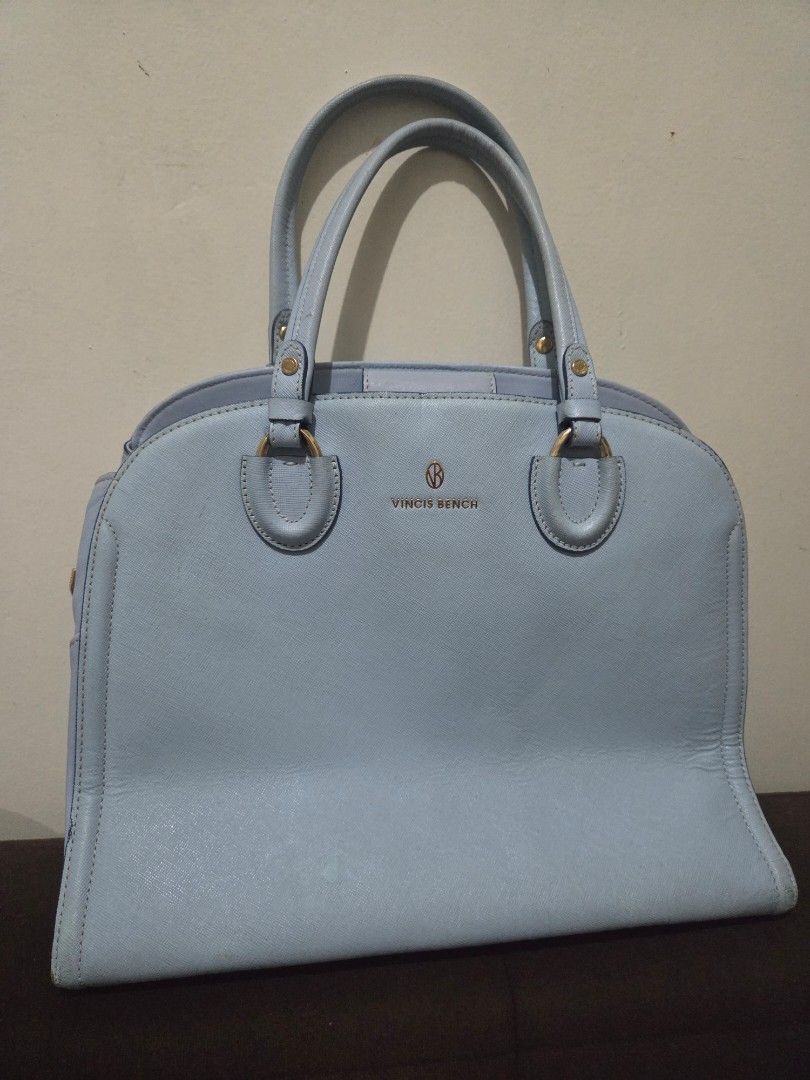 Vincis Bench Light Blue Leather Handbag (Category: Luxury Bags & Wallets) located in Quezon City. Submitted by belladiva (Listing ID 1468521229, Image 1). Description: - Brand/Model: Vincis Bench Handbag - Color: Light Blue with Gold-toned hardware - Material: Premium textured leather - Interior: Clean black patterned lining with multiple compartments, zipper pockets, and a slip pocket with magnetic closure - Exterior: Dual top handles and side r