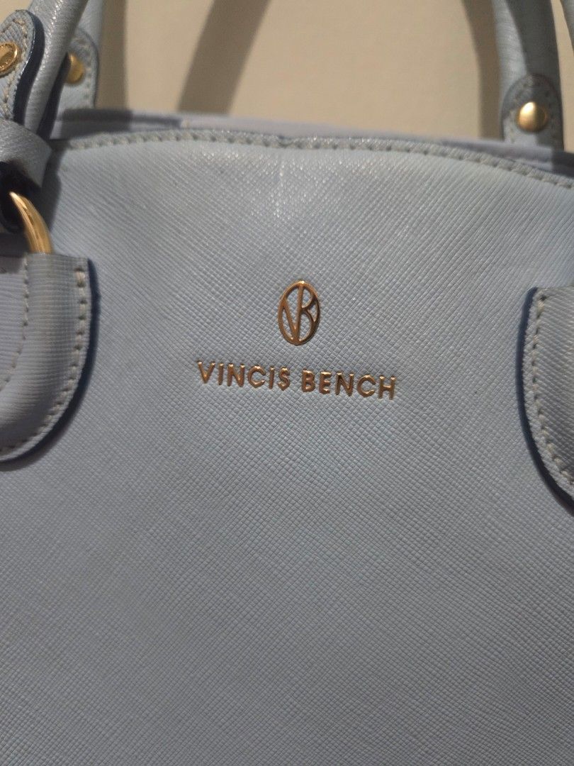 Vincis Bench Light Blue Leather Handbag (Category: Luxury Bags & Wallets) located in Quezon City. Submitted by belladiva (Listing ID 1468521229, Image 2). Description: - Brand/Model: Vincis Bench Handbag - Color: Light Blue with Gold-toned hardware - Material: Premium textured leather - Interior: Clean black patterned lining with multiple compartments, zipper pockets, and a slip pocket with magnetic closure - Exterior: Dual top handles and side r