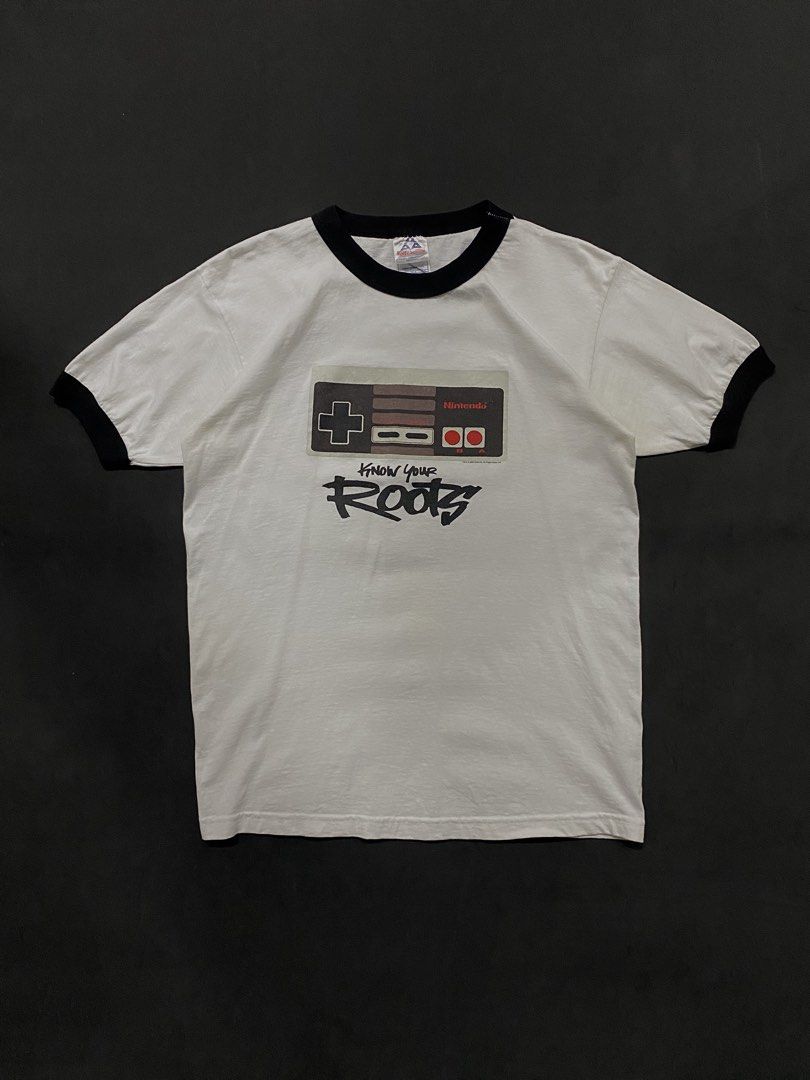 Vintage 2003 Nintendo NES/Famicom Controller "Know Your Roots" Ringer Tee (Category: Tshirts & Polo Shirts ) located in Quezon City. Submitted by rlphvncntbs (Listing ID 1468510534, Image 1). Description: Vintage 2003 Nintendo NES/Famicom Controller "Know Your Roots" Ringer Tee Size: Medium Measurements: 20.5" x 27" Flaws: Hairline Cracks Excellent Condition Triple A Tag ₱1,800 + SF (Negotiable).