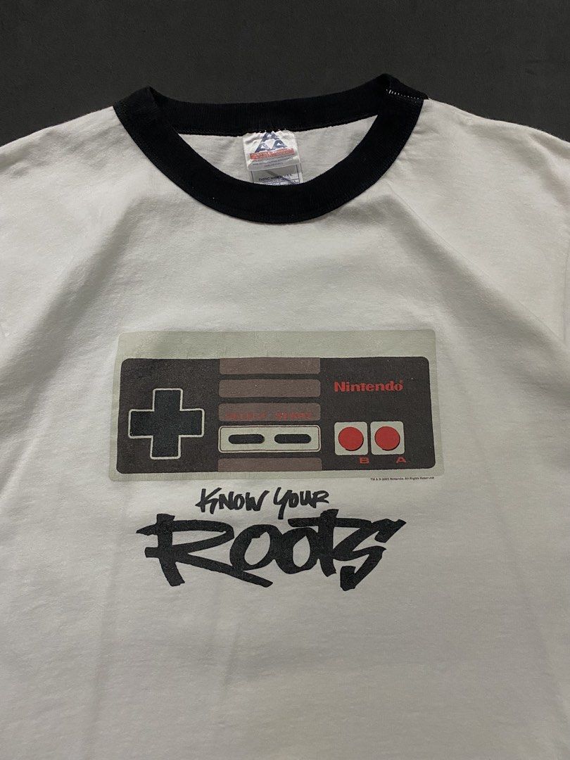 Vintage 2003 Nintendo NES/Famicom Controller "Know Your Roots" Ringer Tee (Category: Tshirts & Polo Shirts ) located in Quezon City. Submitted by rlphvncntbs (Listing ID 1468510534, Image 2). Description: Vintage 2003 Nintendo NES/Famicom Controller "Know Your Roots" Ringer Tee Size: Medium Measurements: 20.5" x 27" Flaws: Hairline Cracks Excellent Condition Triple A Tag ₱1,800 + SF (Negotiable).