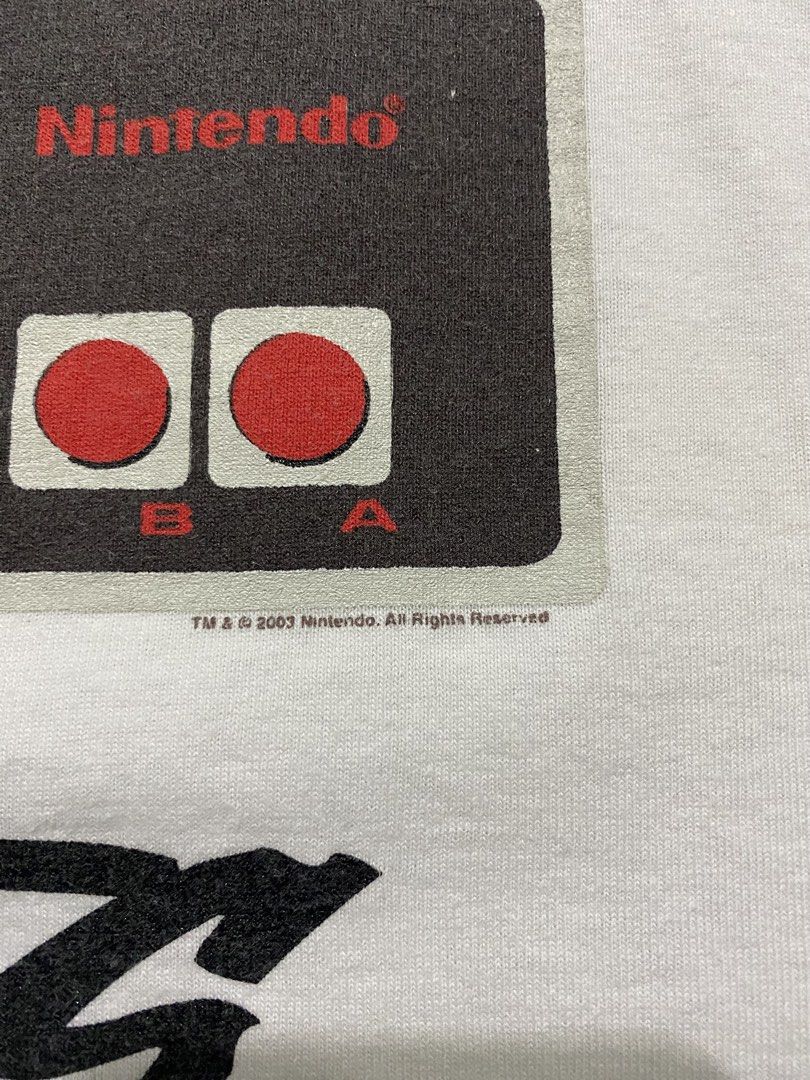 Vintage 2003 Nintendo NES/Famicom Controller "Know Your Roots" Ringer Tee (Category: Tshirts & Polo Shirts ) located in Quezon City. Submitted by rlphvncntbs (Listing ID 1468510534, Image 3). Description: Vintage 2003 Nintendo NES/Famicom Controller "Know Your Roots" Ringer Tee Size: Medium Measurements: 20.5" x 27" Flaws: Hairline Cracks Excellent Condition Triple A Tag ₱1,800 + SF (Negotiable).