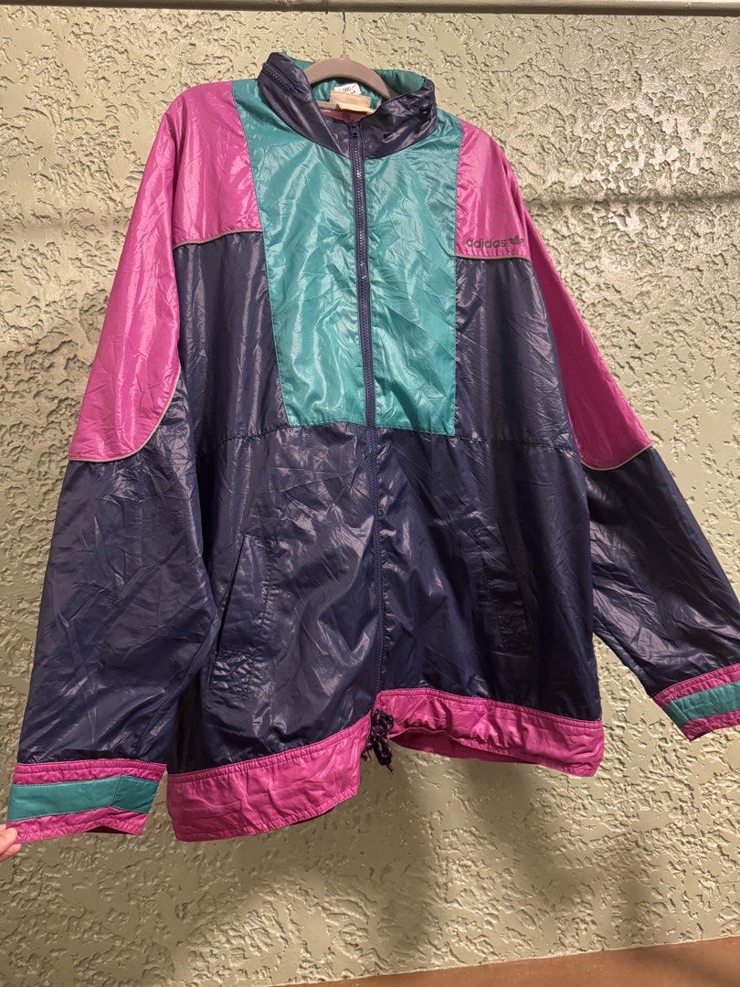 Vintage Adidas Colorblock Windbreaker Jacket (Category: Coats, Jackets and Outerwear) located in Manila. Submitted by m.pat (Listing ID 1468545368, Image 1). Description: - Brand: Adidas - Style: Vintage 90s colorblock windbreaker (Teal, Pink, Dark Blue) - Features: Full zip front, hood, cinched cuffs and hem, embroidered Trefoil logo - Material: Lightweight nylon - Condition: Great retro condition - Perfect for: Streetwear and layering.