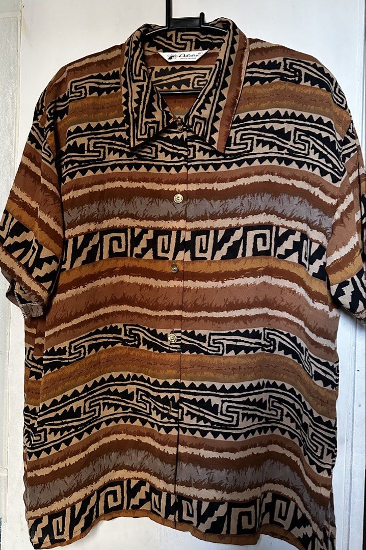 Vintage brown aztec patern button down shirt (Category: Blouses) located in Cavite. Submitted by chicfinds.slay (Listing ID 1468577041, Image 2). Description: ✨vintsge type shirt ✨no flaws ✨relaxed fit(bagsak tela) ✨airy & flowy texture ✨ best for beach ootd ✨ unisex .