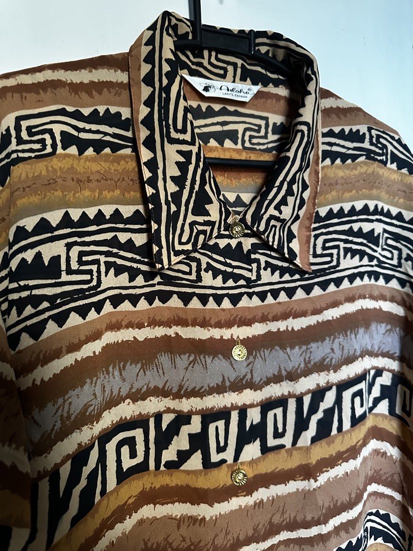 Vintage brown aztec patern button down shirt (Category: Blouses) located in Cavite. Submitted by chicfinds.slay (Listing ID 1468577041, Image 1). Description: ✨vintsge type shirt ✨no flaws ✨relaxed fit(bagsak tela) ✨airy & flowy texture ✨ best for beach ootd ✨ unisex .
