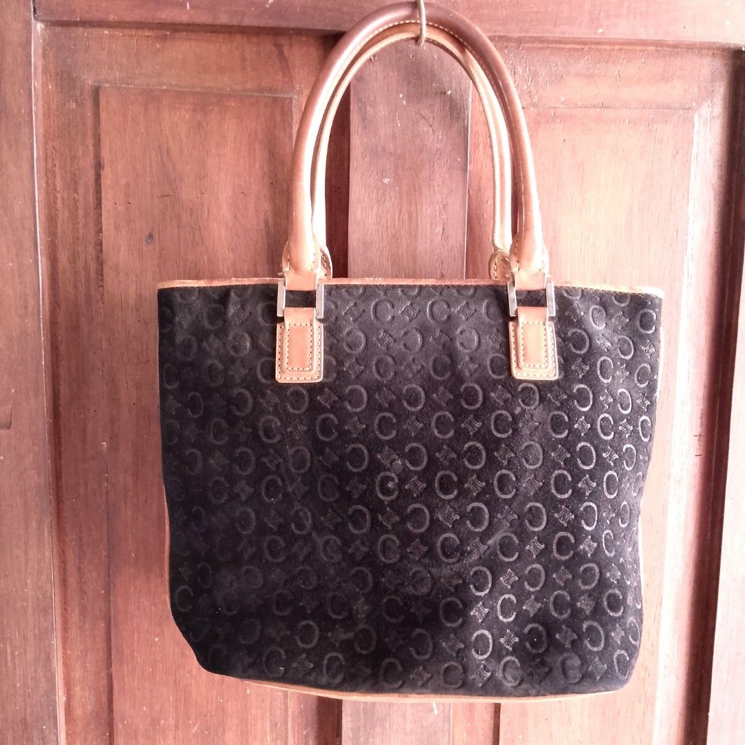 Vintage Celine C Macadam Monogram Suede Tote Bag (Category: Tote Bags) located in Tuguegarao City. Submitted by thriftedtreasures101.1 (Listing ID 1468561678, Image 2). Description: Vintage, authentic Celine C Macadam Suede Monogram Tote Bag from the 1990s. It is crafted from a soft, laser-debossed black suede body contrasted by smooth, structured tan leather handles and matching anchor tabs. Slightly used, in good condition with small flaws as s