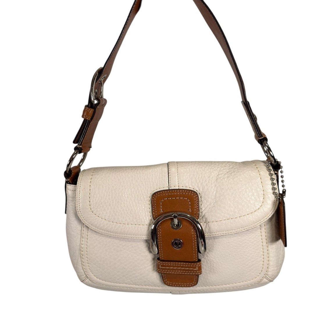 vintage Coach Soho Shoulder Bag (Category: Luxury Bags & Wallets) located in Ivisan. Submitted by trashtotreasuree (Listing ID 1468546950, Image 1). Description: This is a vintage Coach Soho Shoulder Bag (Style F13105) crafted in white pebble leather with brown/tan leather trim and a prominent front buckle detail.