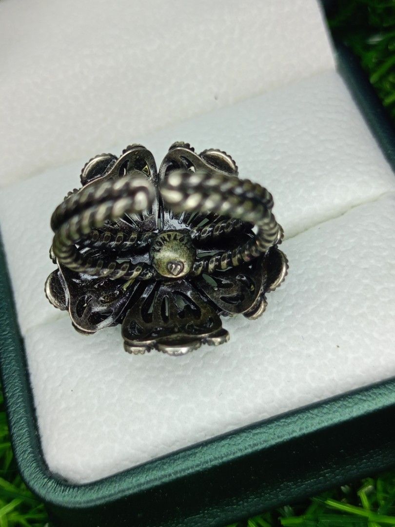 Vintage Flower Rhinestone Adjustable Statement Ring Blue Purple (Category: Rings) located in Bacoor. Submitted by bibelot03 (Listing ID 1468513333, Image 3). Description: - Ornate floral ring with a dark metal finish - Sparkly blue, purple, and pale opalescent rhinestones - Intricate openwork metal setting underneath - Adjustable double-band shank for a comfortable fit - Eye-catching statement piece that shines beautifully in the light.