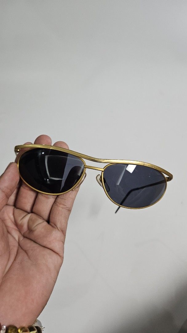 Vintage Gold Aviator Sunglasses (Category: Sunglasses & Eyewear) located in Alfonso. Submitted by jbcamet (Listing ID 1468652286, Image 2). Description: - Style: Classic pilot aviator with a double nose bridge - Frame: Lightweight gold-tone metal with black acetate temple tips - Lenses: Dark tinted for ultimate sun protection - Fit: Intact, adjustable nose pads for all-day comfort - Condition: Brand new / Excellent, great everyday accessory - Mee
