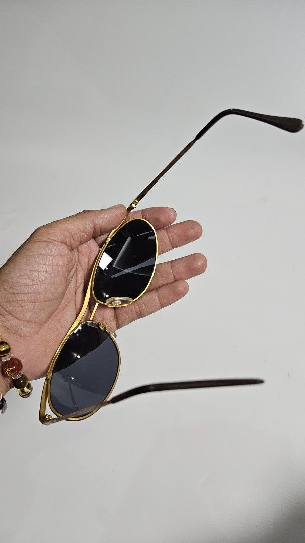 Vintage Gold Aviator Sunglasses (Category: Sunglasses & Eyewear) located in Alfonso. Submitted by jbcamet (Listing ID 1468652286, Image 3). Description: - Style: Classic pilot aviator with a double nose bridge - Frame: Lightweight gold-tone metal with black acetate temple tips - Lenses: Dark tinted for ultimate sun protection - Fit: Intact, adjustable nose pads for all-day comfort - Condition: Brand new / Excellent, great everyday accessory - Mee