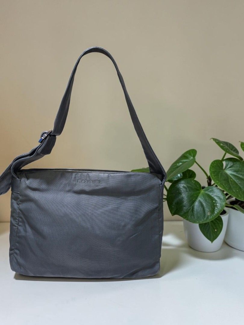 VINTAGE LOEWE MADRID NYLON SHOULDER BAG (Category: Shoulder Bags) located in Las Pinas. Submitted by annachiaonair2037 (Listing ID 1468660320, Image 2). Description: VINTAGE LOEWE MADRID NYLON SHOULDER BAG FROM JAPAN LAMPO ZIP 3 COMPARTMENTS( 2ZIP CLOSURE, 1 OPEN) THICK NYLON WITH LEATHER STRAP ADJUSTABLE STRAP NORMAL SIGN OF USAGE MAYBE PRESENT LUKOT LNG DUE TO STORAGE H 8.5" L 12" W 3" Disclaimer: I am not affiliated with, associated with, or a