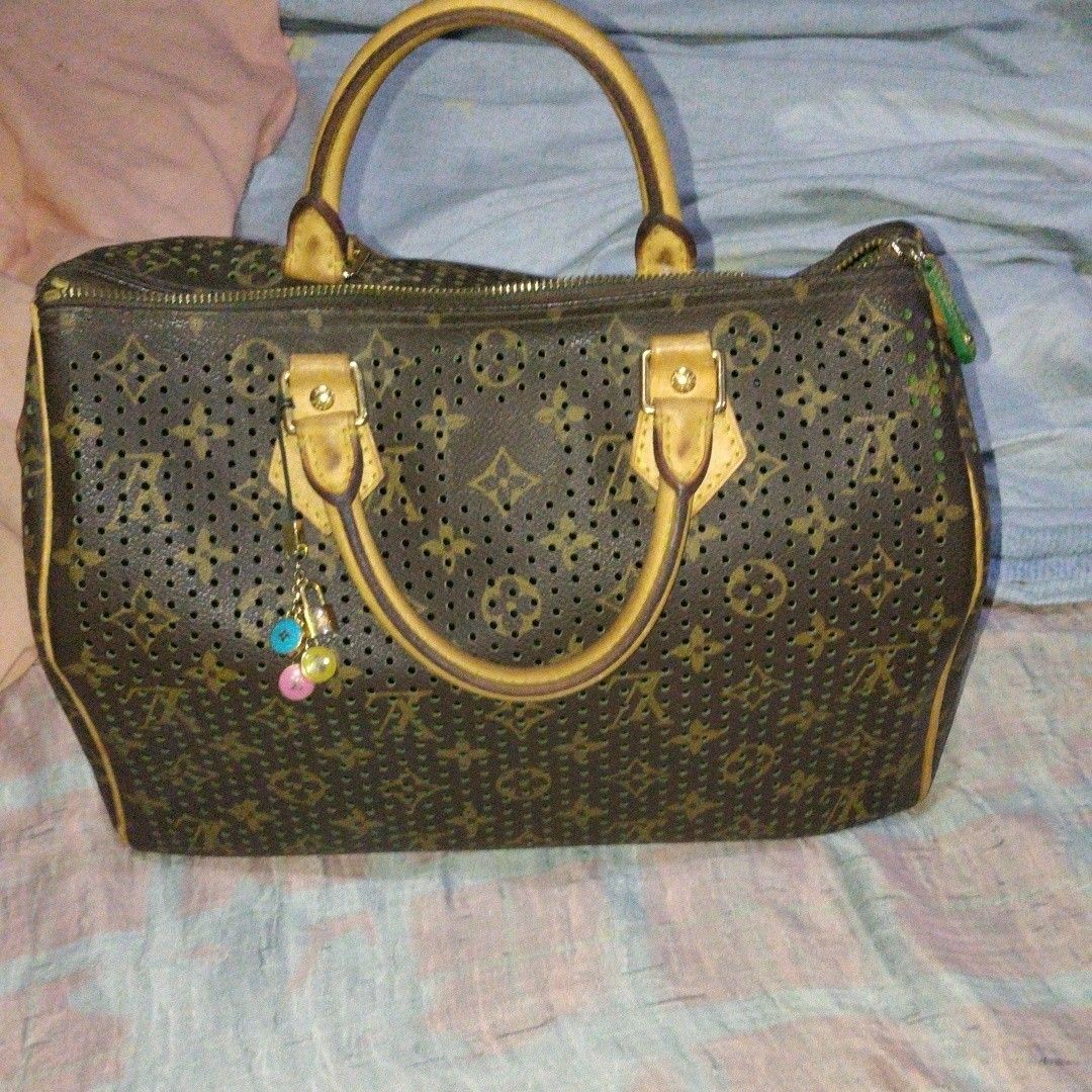 Vintage Louis Vuitton Perforated Monogram Speedy Bag (Category: Luxury Bags & Wallets) located in Manila. Submitted by hobbydubi (Listing ID 1468659933, Image 1). Description: - Authentic Louis Vuitton Monogram Perforated Leather Handbag - Elegant brown exterior paired with a striking green interior lining - Premium Vachetta leather handles, trim, and luggage tag - Gleaming gold-tone hardware featuring a secure zipper closure and padlock - Includ
