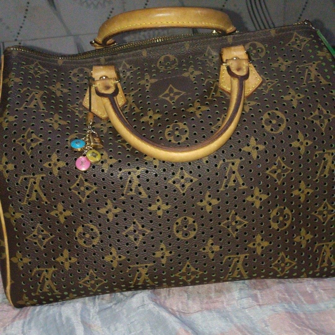 Vintage Louis Vuitton Perforated Monogram Speedy Bag (Category: Luxury Bags & Wallets) located in Manila. Submitted by hobbydubi (Listing ID 1468659933, Image 2). Description: - Authentic Louis Vuitton Monogram Perforated Leather Handbag - Elegant brown exterior paired with a striking green interior lining - Premium Vachetta leather handles, trim, and luggage tag - Gleaming gold-tone hardware featuring a secure zipper closure and padlock - Includ