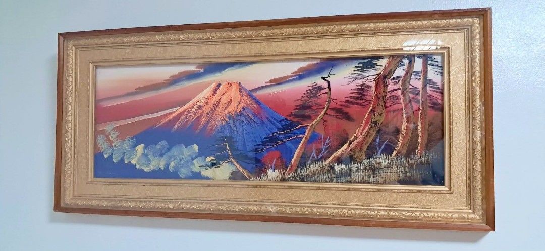 Vintage Mountain paint (Category: Frames & Pictures) located in Las Pinas. Submitted by mamshie_tin (Listing ID 1468545367, Image 1). Description: - Large framed landscape of mountain at sunset - Features detailed brushwork with vibrant red, blue, and orange tones - Framed with an ornate gold textured inner mat and simple dark wood outer frame - Ready to hang on the wall - Ideal horizontal statement piece for a living room or office space.