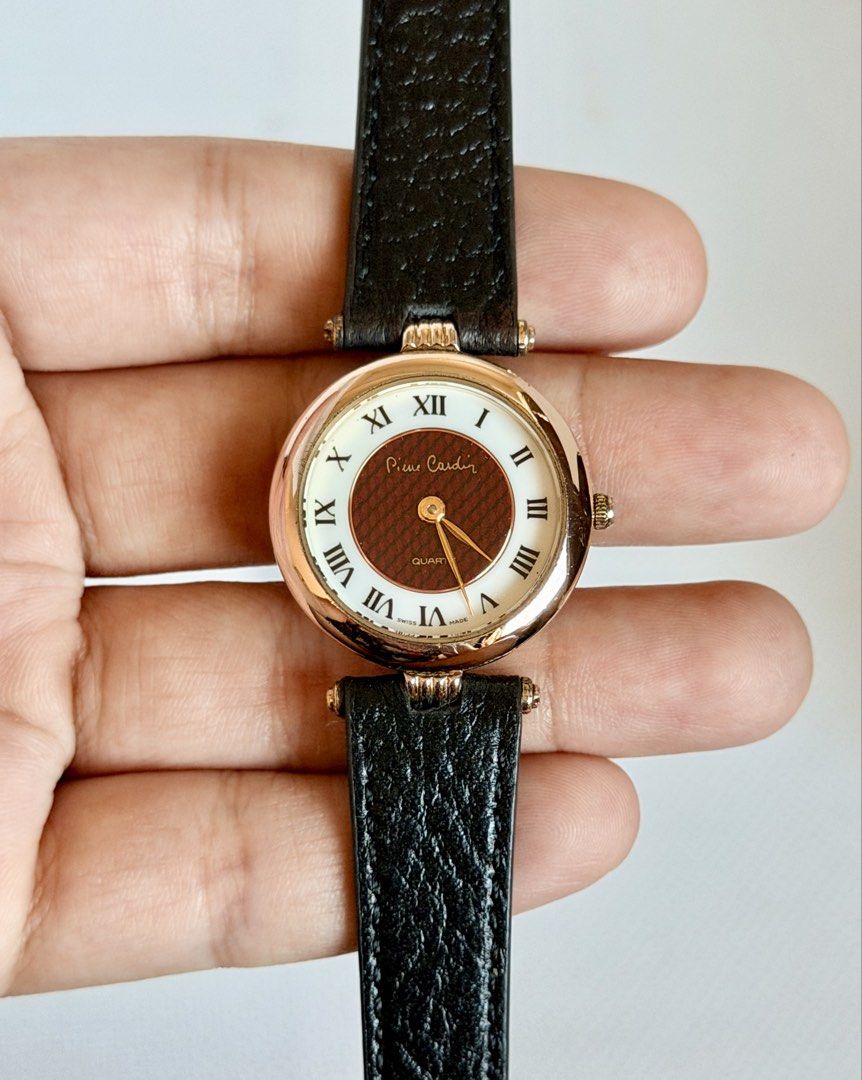 Vintage Pierre Cardin (Category: Women's Watches) located in Manila. Submitted by vibeandvintage (Listing ID 1468605151, Image 1). Description: ⌚️ Vintage Pierre Cardin •Ladies •Quartz movement •Dual-tone dial, reddish-brown centerpiece •Gold-tone case •25mm case diameter (excluding crown) •Up to 7.5 inches wrist size •Original watch head •New leather strap •With signs of usage •Good working condition •Unit only — no papers •Comes with a presenta