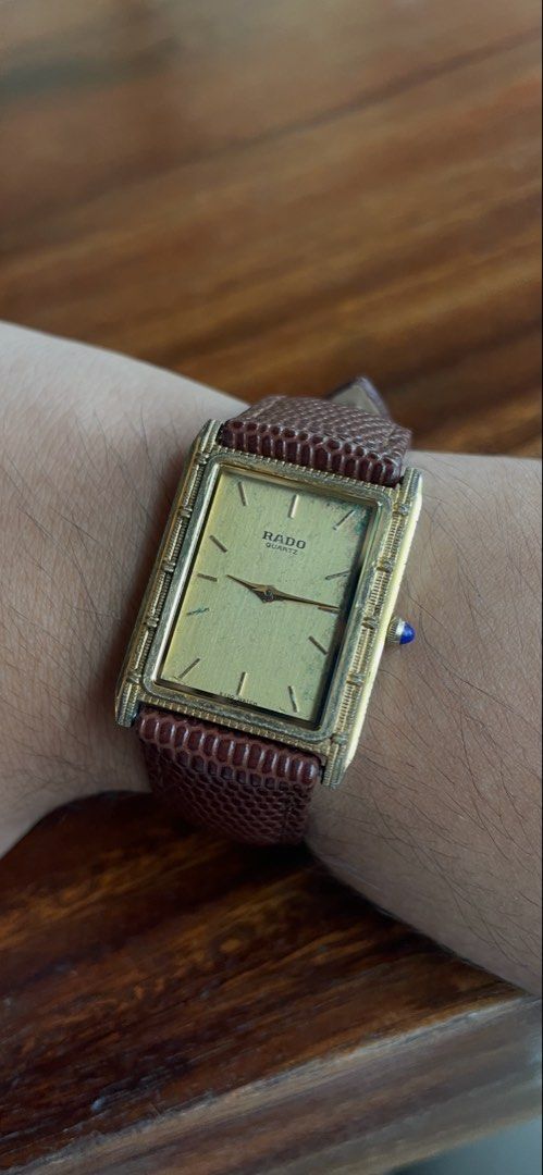 Vintage Rado Quartz Gold Rectangular Dial Watch (Category: Luxury Watches) located in Antipolo. Submitted by ac5555 (Listing ID 1468561001, Image 1). Description: RARE Vintage Rado Tank Braided case 29mm Patina on dial Ref 121.9027.2 NO RESERVE.