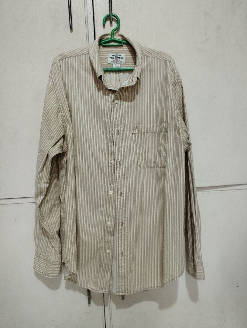 Vintage Ralph Lauren Button Down Shirt (Category: Tshirts & Polo Shirts ) located in San Fernando. Submitted by nerosales (Listing ID 1468505897, Image 1). Description: Vintage Ralph Lauren Polo Jeans Button Down Shirt width - 22 inches length 31 inches issue: very light stain sa harap, halos hindi halata (please see last photo). 400 pesos only SM City Pampanga Shipping: J&T Payment : Gcash NO COD NO COP NO WAYBILL FIRST .