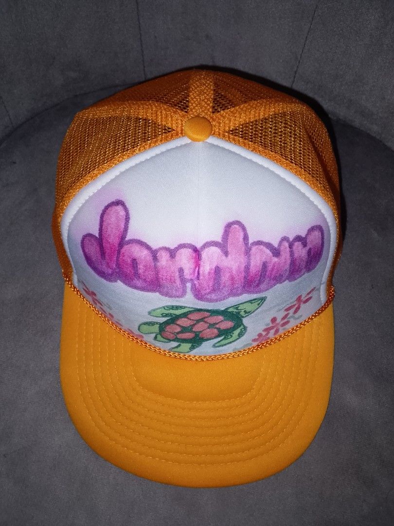 Vintage Yellow Tropical Sea Turtle Customized Trucker Hat (Category: Caps & Hats) located in Binangonan. Submitted by yuristalin888 (Listing ID 1468660052, Image 3). Description: Add a fun tropical touch to your style with this vibrant yellow trucker hat featuring a colorful sea turtle and floral artwork. Designed with a white front panel, breathable mesh backing, and a curved brim, it’s perfect for beach trips, summer outings, and casual everyda