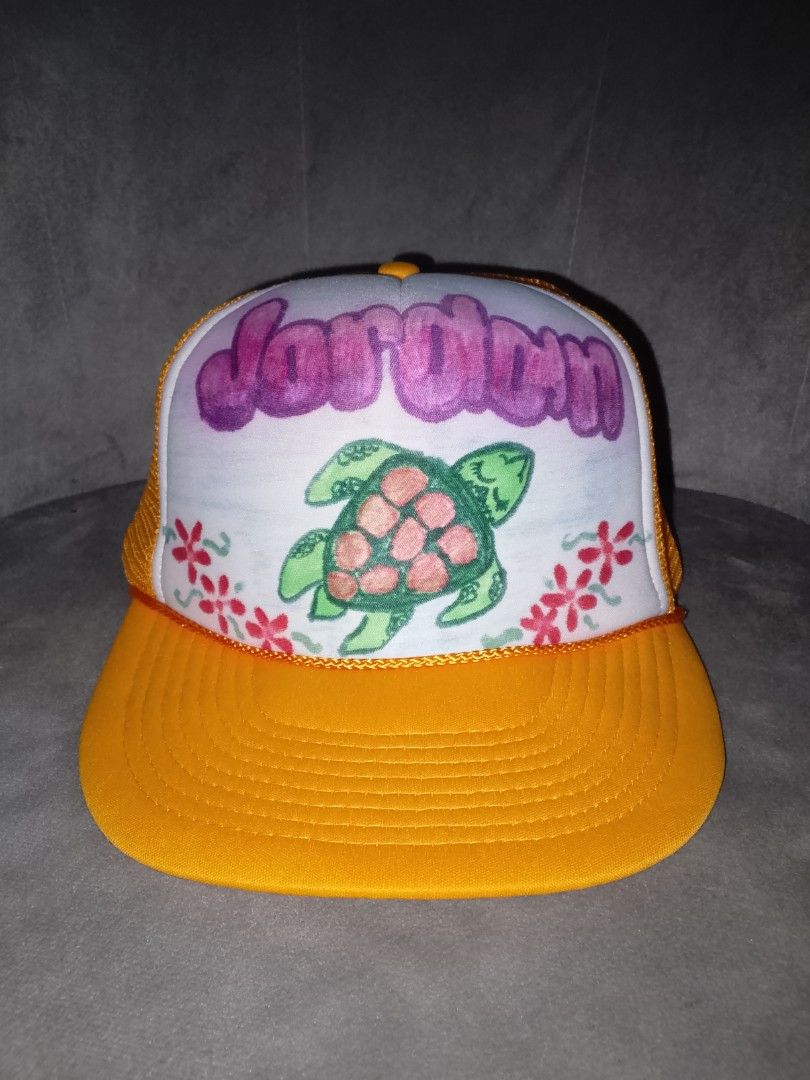 Vintage Yellow Tropical Sea Turtle Customized Trucker Hat (Category: Caps & Hats) located in Binangonan. Submitted by yuristalin888 (Listing ID 1468660052, Image 2). Description: Add a fun tropical touch to your style with this vibrant yellow trucker hat featuring a colorful sea turtle and floral artwork. Designed with a white front panel, breathable mesh backing, and a curved brim, it’s perfect for beach trips, summer outings, and casual everyda