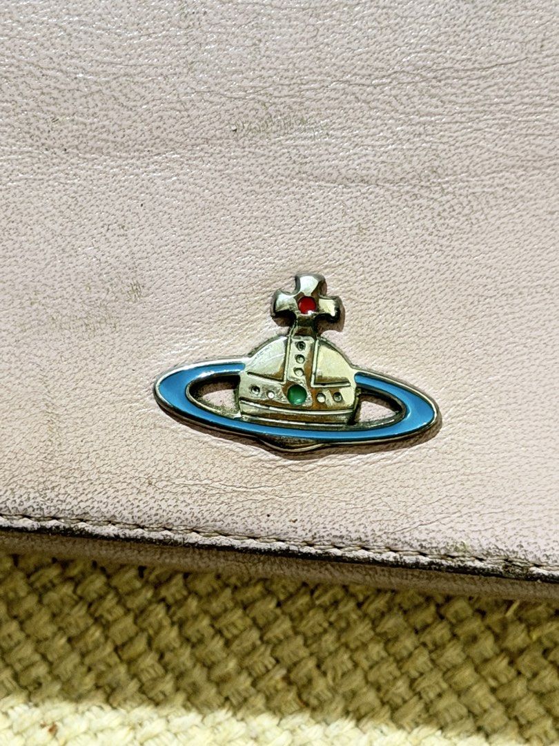 Vivienne westwood Pink Wallet (Category: Wallets & Card holders) located in Manila. Submitted by angelconscious (Listing ID 1468689592, Image 2). Description: Authentic, no issues other than normal wears on the side, no bad smell, has coin purse.
