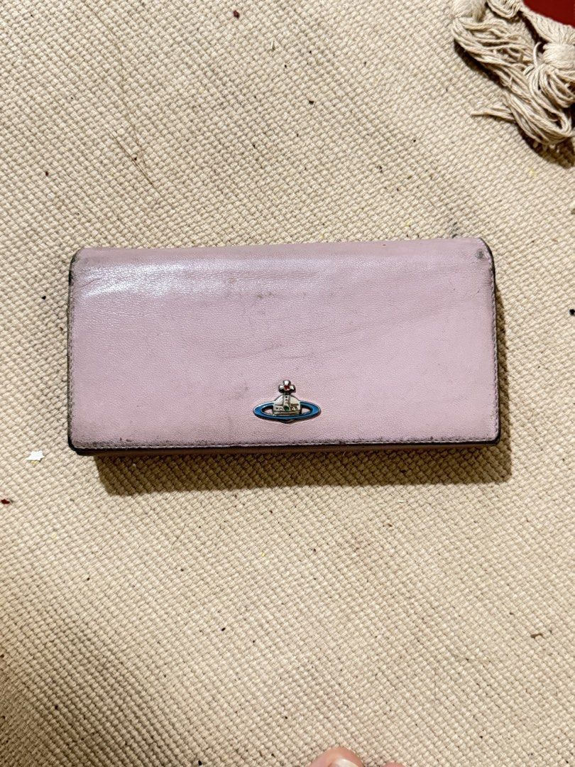 Vivienne westwood Pink Wallet (Category: Wallets & Card holders) located in Manila. Submitted by angelconscious (Listing ID 1468689592, Image 1). Description: Authentic, no issues other than normal wears on the side, no bad smell, has coin purse.