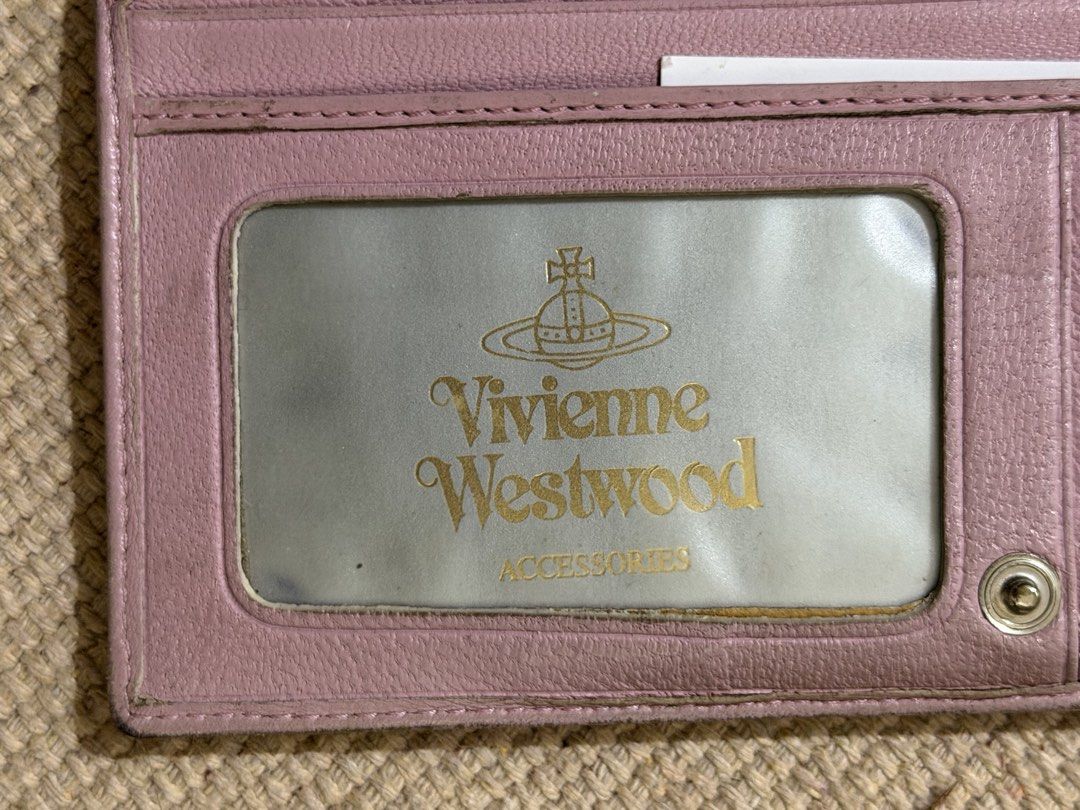 Vivienne westwood Pink Wallet (Category: Wallets & Card holders) located in Manila. Submitted by angelconscious (Listing ID 1468689592, Image 3). Description: Authentic, no issues other than normal wears on the side, no bad smell, has coin purse.