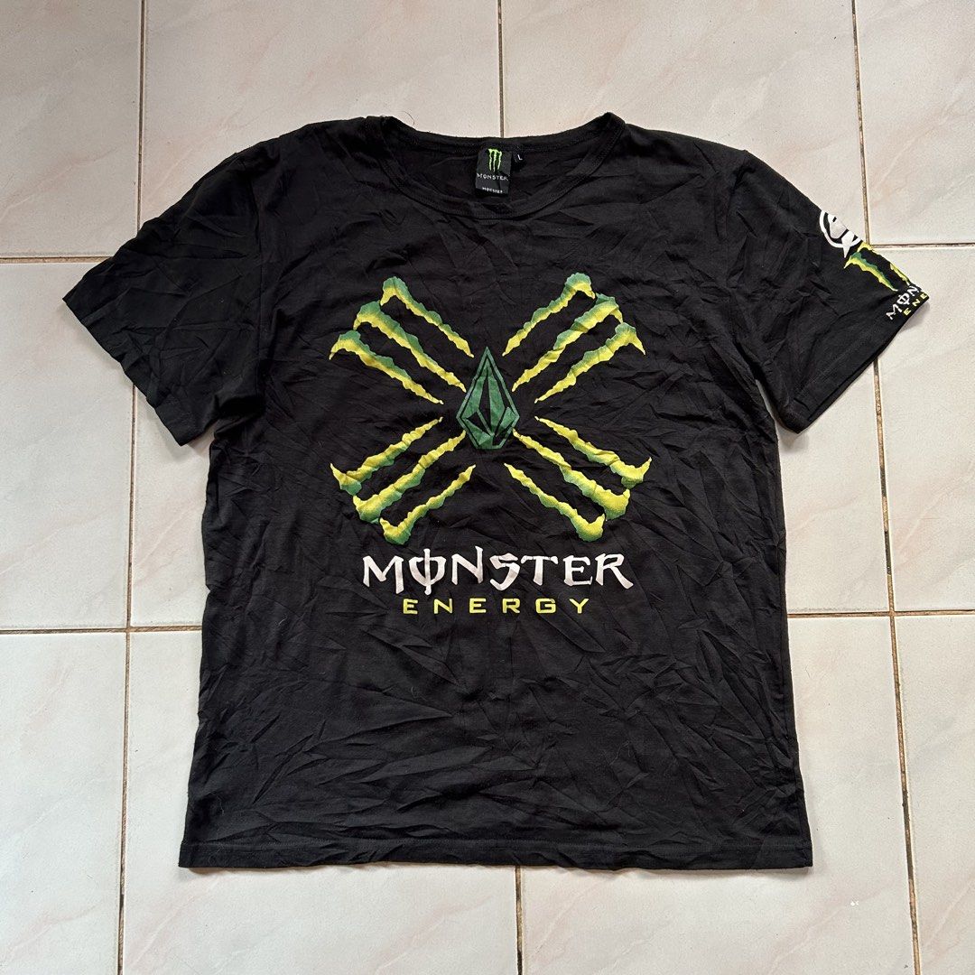 Volcom x Monster Energy shirt 🔥 (Category: Activewear) located in Jinoba-an. Submitted by eegiboy (Listing ID 1468533949, Image 1). Description: - Brand: Volcom x Monster Energy Collaboration - Item: Short Sleeve Graphic Tee - Color: Black - Size: L (Large) - Design: Large green claw marks with Volcom stone logo and Monster Energy branding on front; small graphic on left sleeve - Condition: Minor wear and slight wrinkling from storage, overall s