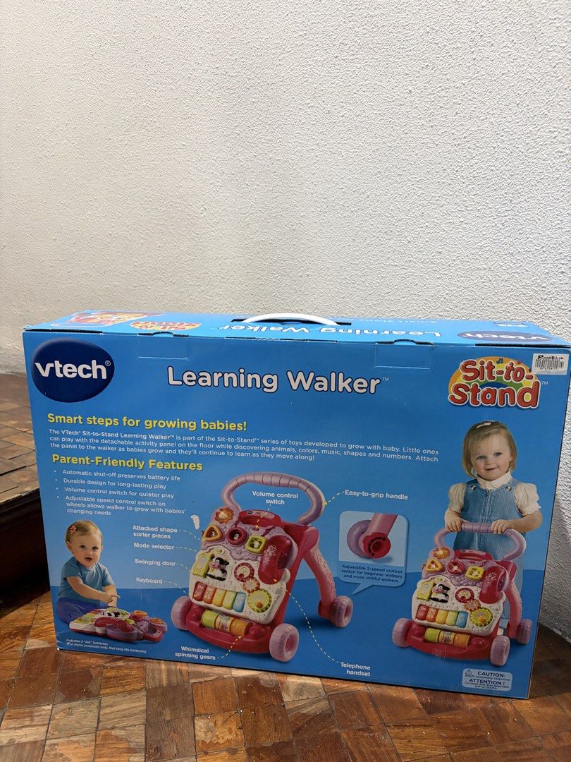 VTech Sit-to-Stand Learning Walker Pink (Category: Infant Playtime) located in Quezon City. Submitted by KRC07 (Listing ID 1468591149, Image 2). Description: - Brand: VTech Sit-to-Stand Learning Walker (Pink) - Condition: Brand new, still packed inside original box - Age Range: Suitable for babies 9 to 36 months old - Key Features: Detachable interactive play panel, piano keys, shape sorters, spinning gears, telephone handset, and glowing buttons