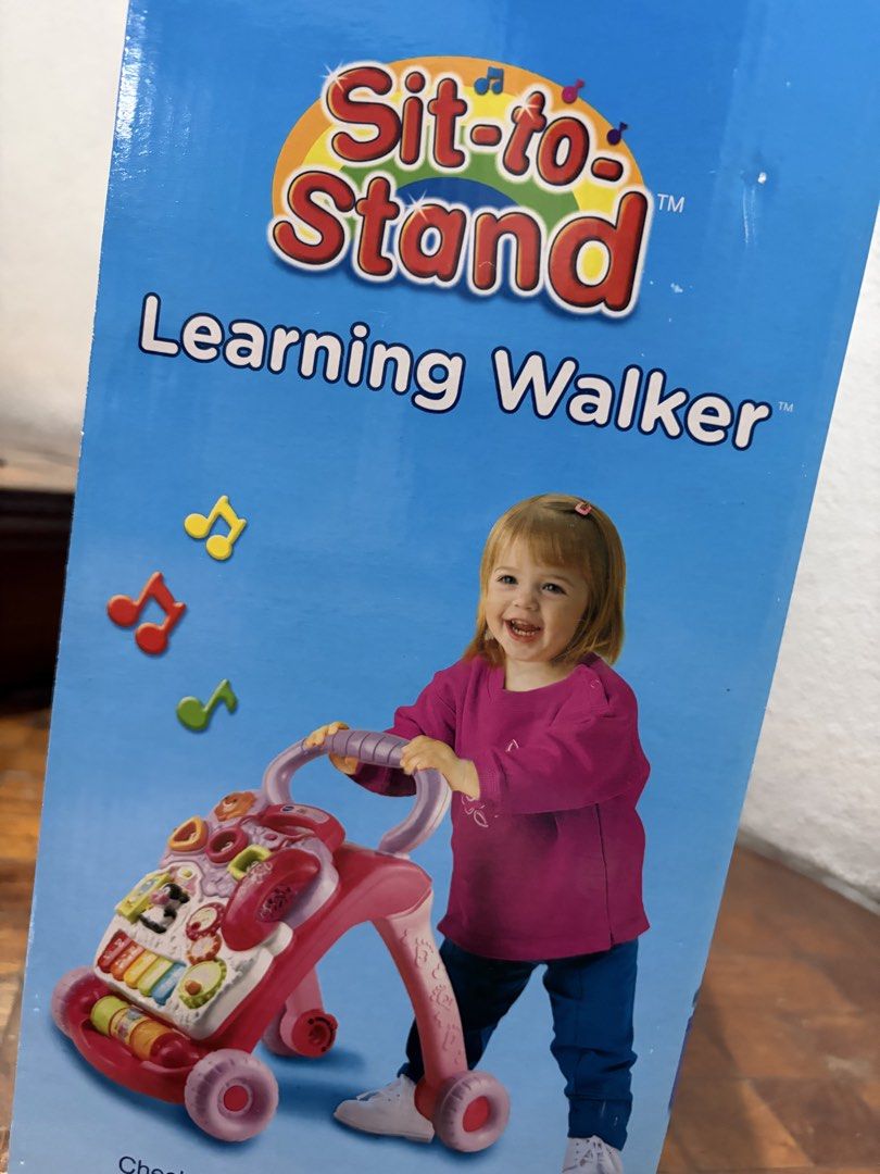 VTech Sit-to-Stand Learning Walker Pink (Category: Infant Playtime) located in Quezon City. Submitted by KRC07 (Listing ID 1468591149, Image 3). Description: - Brand: VTech Sit-to-Stand Learning Walker (Pink) - Condition: Brand new, still packed inside original box - Age Range: Suitable for babies 9 to 36 months old - Key Features: Detachable interactive play panel, piano keys, shape sorters, spinning gears, telephone handset, and glowing buttons