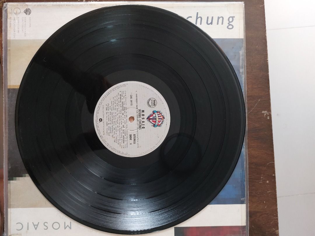 Wang Chung Mosaic Vinyl LP Record (Category: Vinyls) located in Quezon City. Submitted by safefish_95f205 (Listing ID 1468521909, Image 2). Description: - Artist/Album: Wang Chung - Mosaic LP - Label: Warner Bros Records - Format: Standard black 12-inch vinyl - Key Tracks: 'Everybody Have Fun Tonight', 'Let's Go' - Condition: Outer sleeve has moderate wear along edges and corners - Perfect for: 80s synth-pop collectors and retro music lovers.