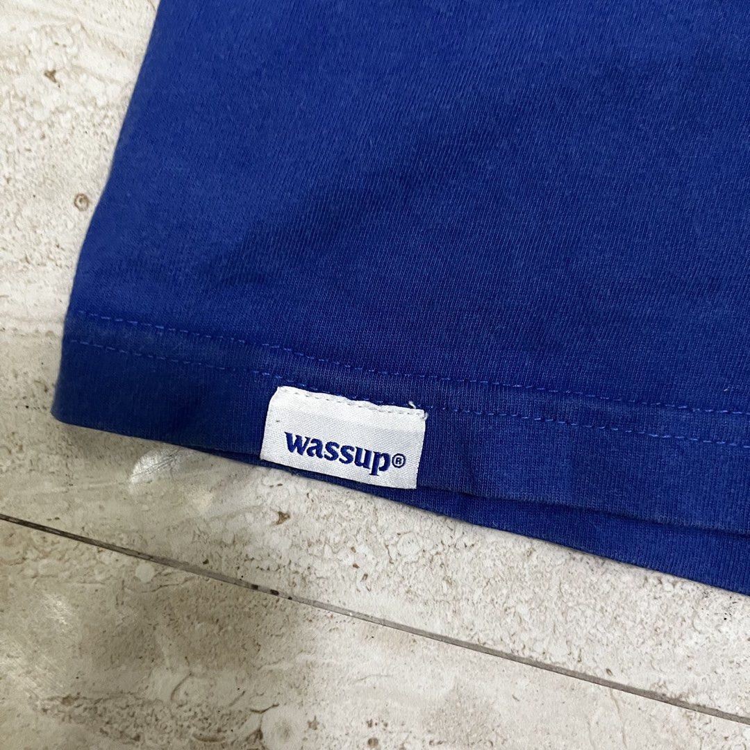 Wassup Blue T-Shirt Size M (Category: Tshirts & Polo Shirts ) located in Polangui. Submitted by rodss7 (Listing ID 1468611482, Image 2). Description: - Brand: Wassup - Color: Blue with big white chest logo - Size: M (fits true) - Fit: Standard short sleeve crew neck - Condition: Normal wear, tags intact - Details: Small woven label at the hem - Ideal for comfortable daily wear.