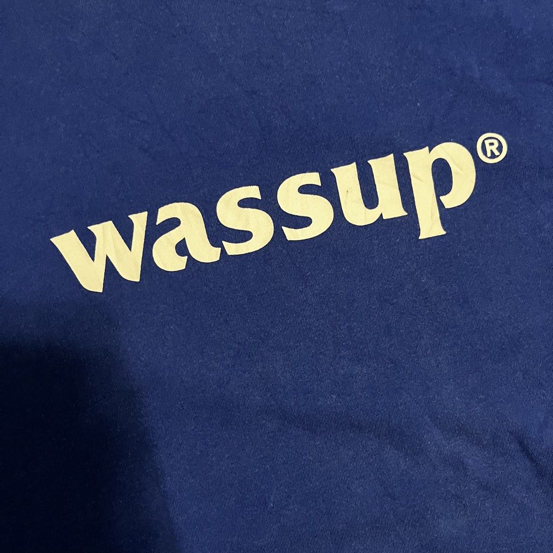 Wassup Blue T-Shirt Size M (Category: Tshirts & Polo Shirts ) located in Polangui. Submitted by rodss7 (Listing ID 1468611482, Image 3). Description: - Brand: Wassup - Color: Blue with big white chest logo - Size: M (fits true) - Fit: Standard short sleeve crew neck - Condition: Normal wear, tags intact - Details: Small woven label at the hem - Ideal for comfortable daily wear.