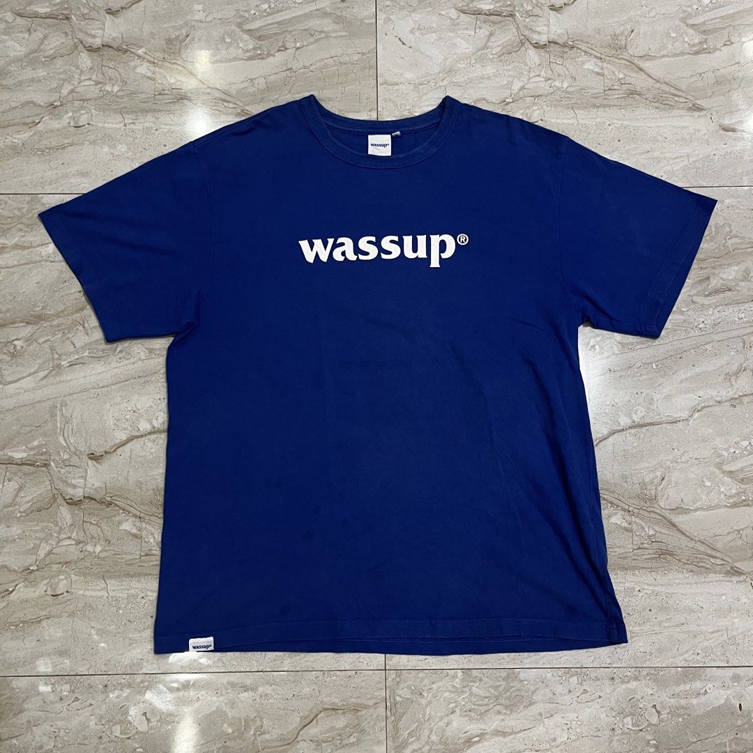 Wassup Blue T-Shirt Size M (Category: Tshirts & Polo Shirts ) located in Polangui. Submitted by rodss7 (Listing ID 1468611482, Image 1). Description: - Brand: Wassup - Color: Blue with big white chest logo - Size: M (fits true) - Fit: Standard short sleeve crew neck - Condition: Normal wear, tags intact - Details: Small woven label at the hem - Ideal for comfortable daily wear.