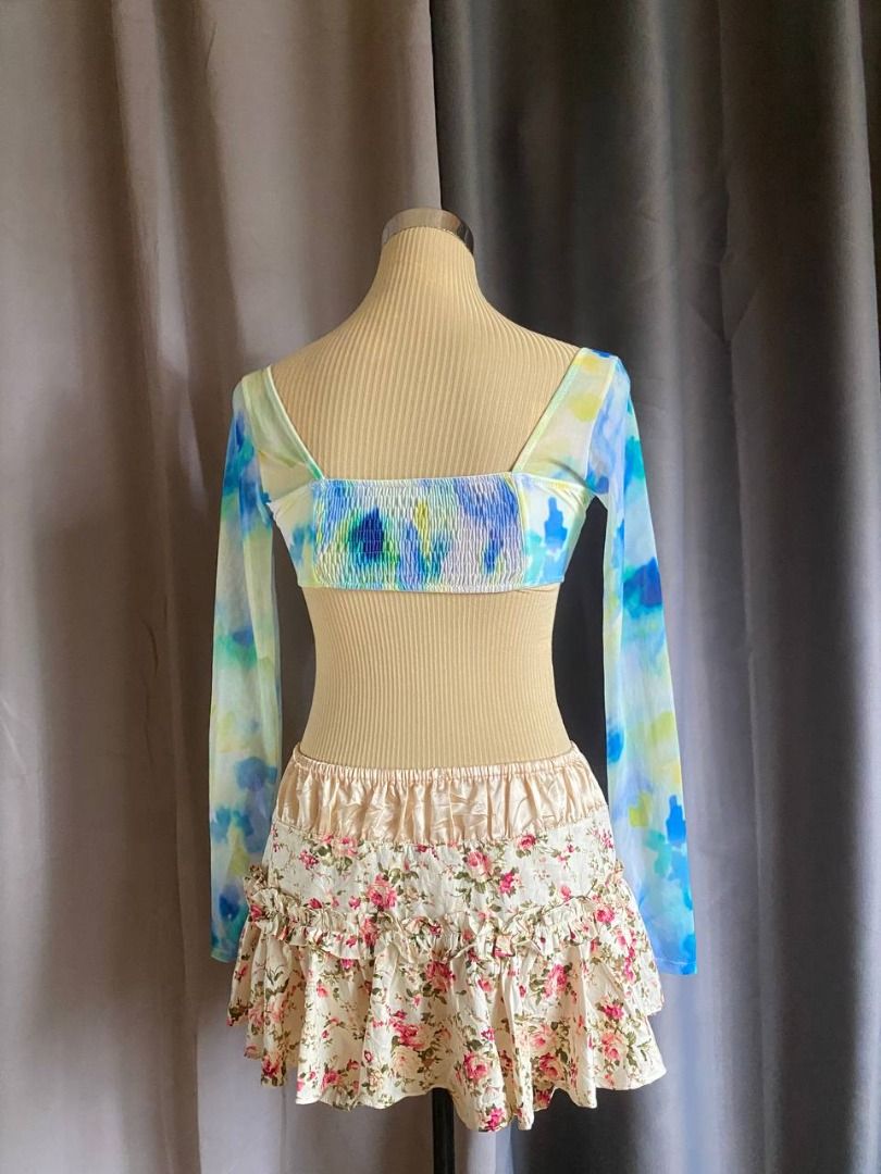 Watercolor Mesh Long Sleeve Underwire Top (Category: Sleeveless) located in Cagayan de Oro. Submitted by curated_closetph (Listing ID 1468554291, Image 3). Description: — Size: XS - S — Color: Blue / Green / Yellow — Vibrant abstract watercolor print — Structured underwired cups for lift and support — Sheer mesh long sleeves — Stretchy smocked back for a flexible, comfortable fit — Ultra-cropped hemline — Can negotiate the price — 🛒 Shop more to