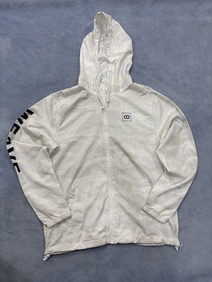 WEAVE CAMO WINDBREAKER (Category: Coats, Jackets and Outerwear) located in Alburquerque. Submitted by ukay_ni_edgar (Listing ID 1468572526, Image 1). Description: Clean monochrome camo with a modern streetwear edge. This WEAVE hooded windbreaker features an all-over light grey camouflage pattern, bold sleeve branding, and a minimalist chest logo. Perfect for everyday fits and lightweight layering..
