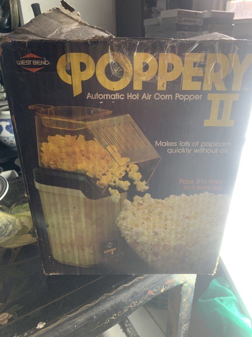 West Bend Poppery II Automatic Hot Air Corn Popper (Category: Cookware & Accessories) located in Quezon City. Submitted by sojisup (Listing ID 1468563059, Image 3). Description: - Brand/Model: West Bend Poppery II - Capacity: Pops 3.5 liters of popcorn - Speed: Ready in just 3 minutes - Healthy: 100% oil-free hot air popping - Condition: Comes in original cardboard box (bilingual English/French packaging) still in box never used .